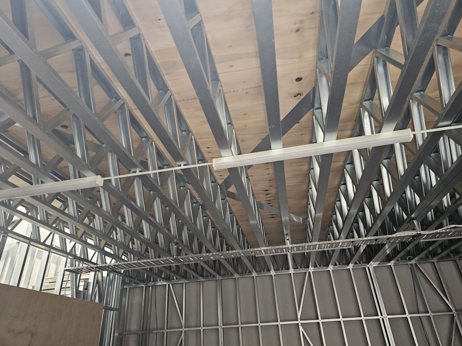 Underside of a light gauge steel mezzanine floor with plywood decking
